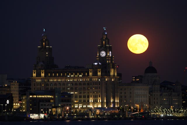 The Sturgeon supermoon, the final supermoon of the year, rises over the Royal Liver Building in Liverpool (Peter Byrne/PA)