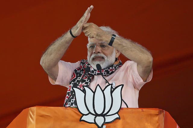 <p>Indian Prime Minister Narendra Modi gestures as he speaks during an election campaign rally of his Bharatiya Janata Party (BJP) </p>