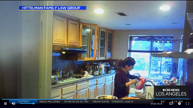 <p>A screengrab from a hidden camera shows dermatologist Yue Emily Yu allegedly spiking her husband’s lemonade </p>