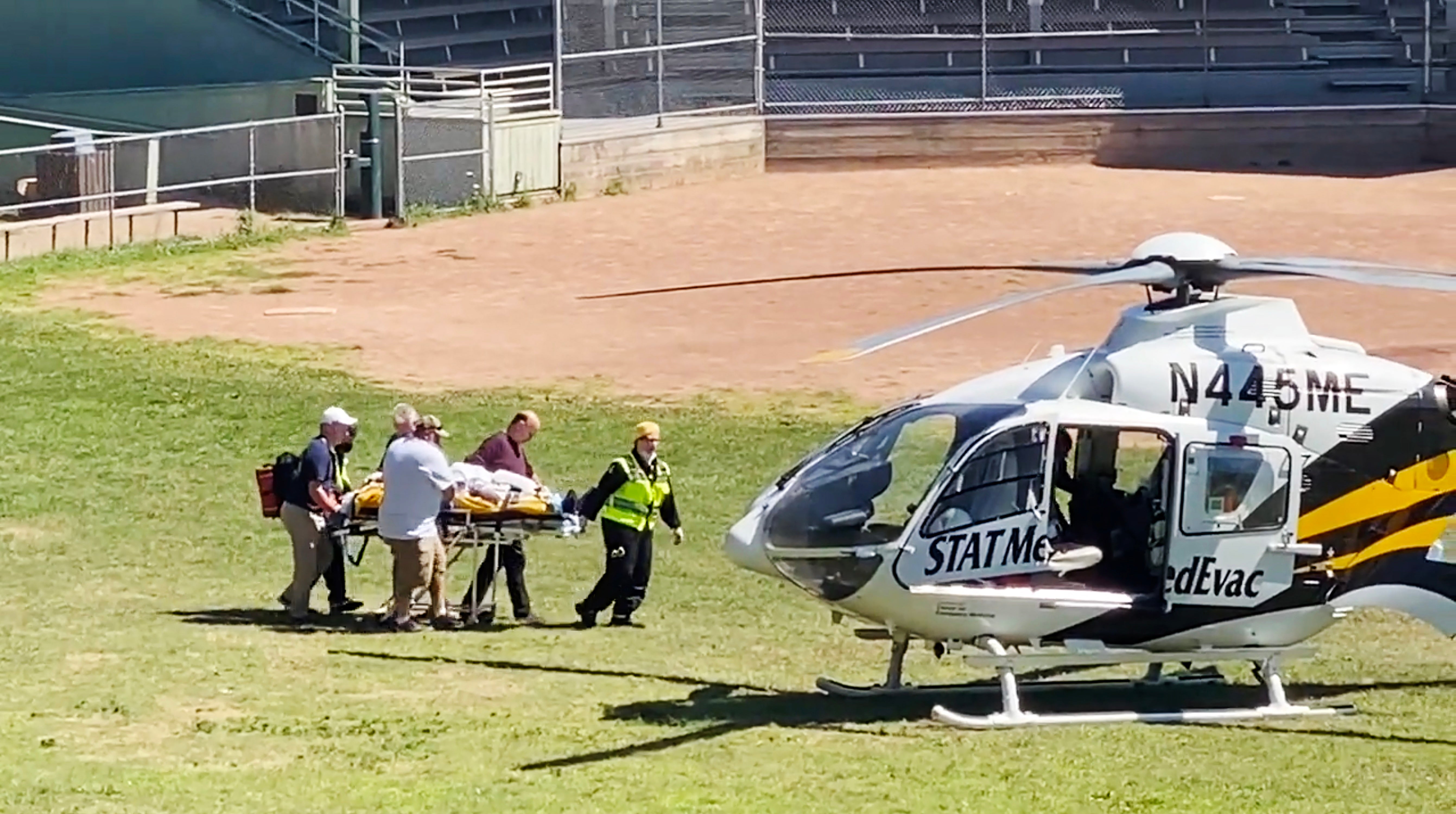 Salman Rushdie being loaded into a MedEvac helicopter
