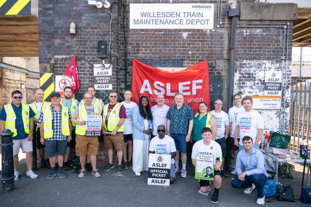 Aslef general secretary Mick Whelan (centre) and Labour MPs Dawn Butler and Barry Gardiner at a picket line at Willesden Junction station in London (Dominic Lipinski/PA)