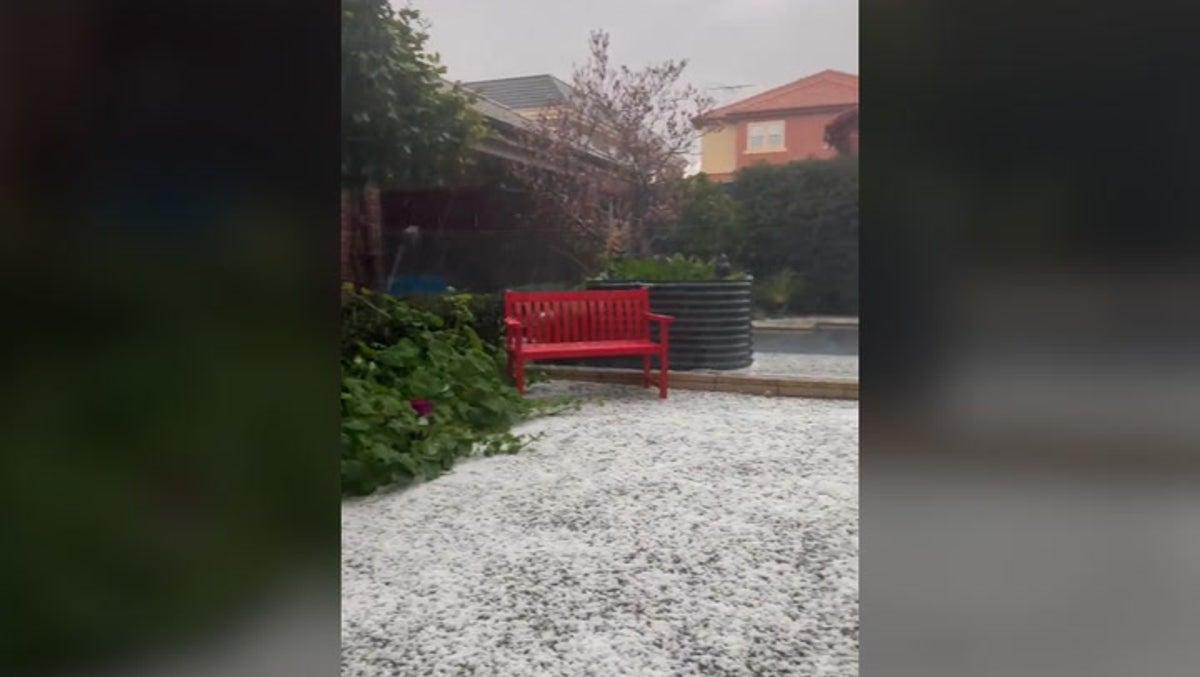 Hail blankets ground white as it lashes parts of Melbourne during ‘freak storm’