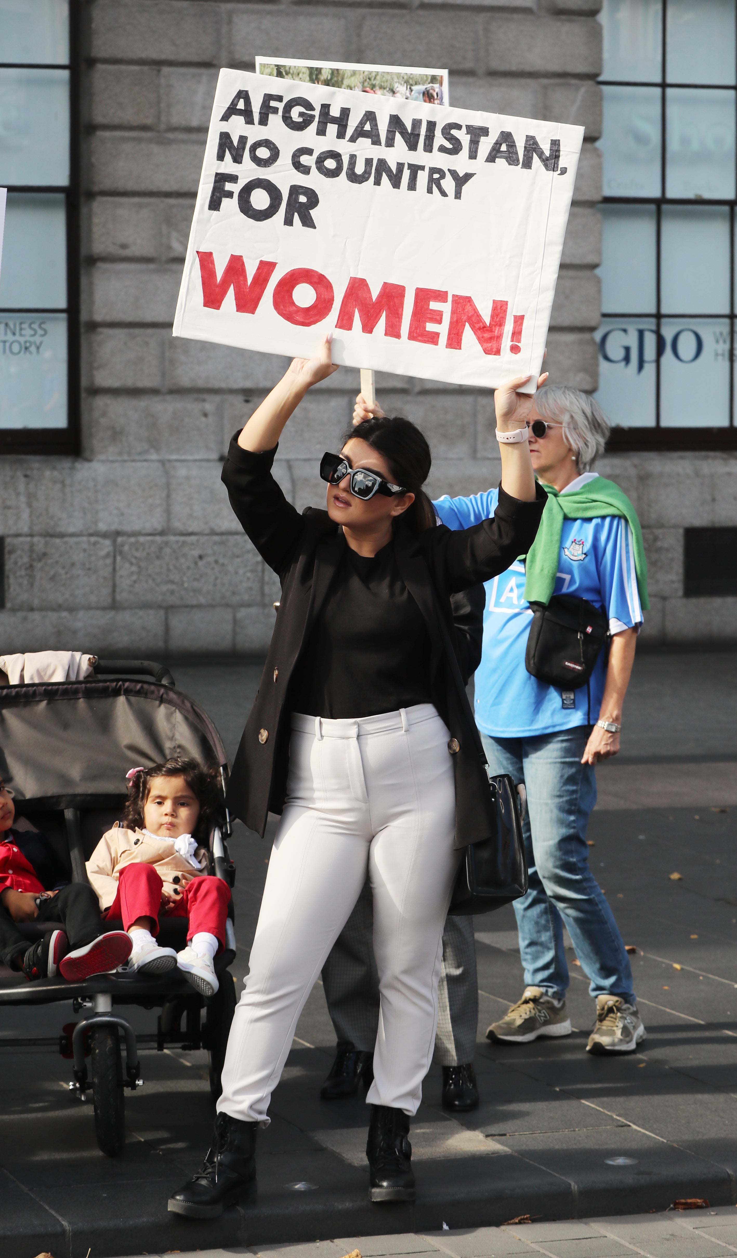 A woman attends a protest against Taliban persecution of women on Dublin’s O’Connell Street (Niall Carson/PA)