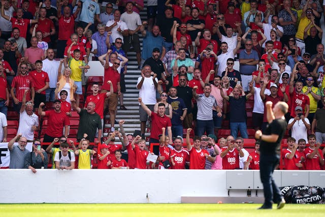 <p>Nottingham Forest manager Steve Cooper celebrates in front of the fans after the final whistle</p>