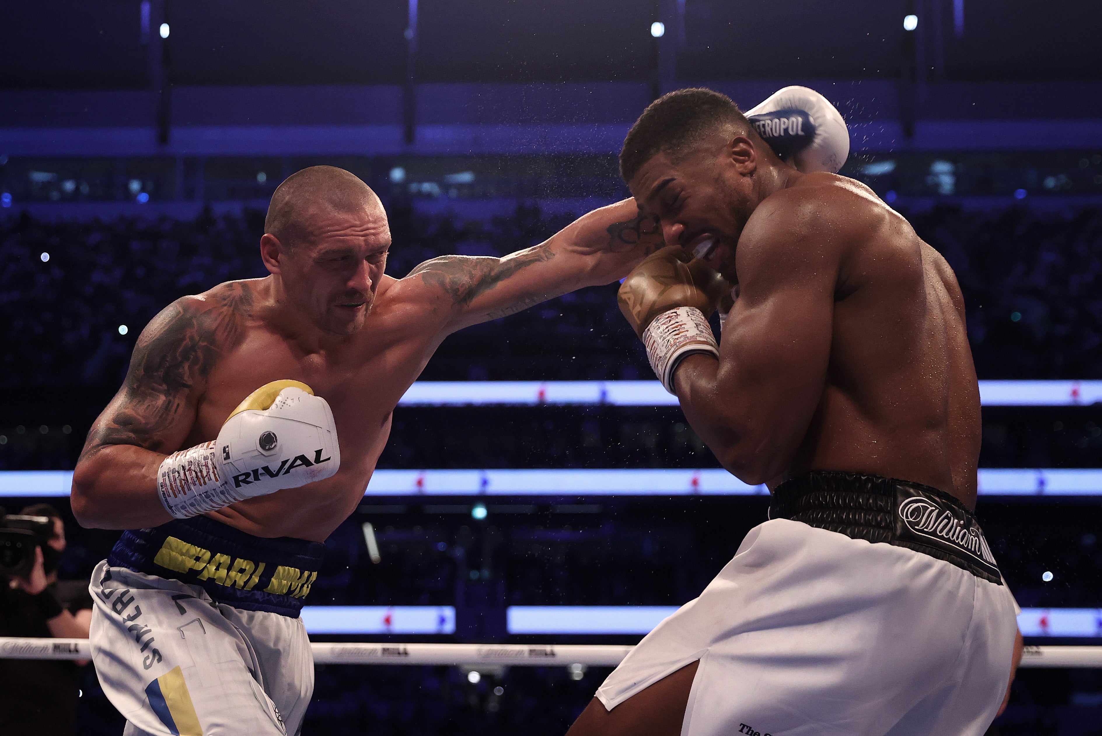 Oleksandr Usyk (left) during his decision win against Anthony Joshua in London