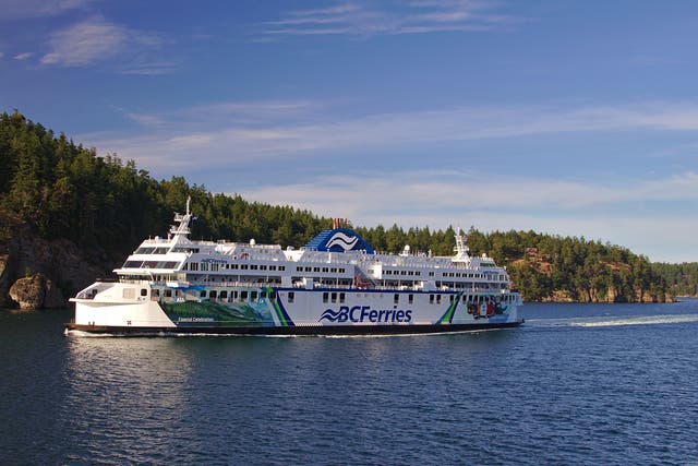 <p>A British Columbia ferry sailing past the Gulf Islands, Canada</p>