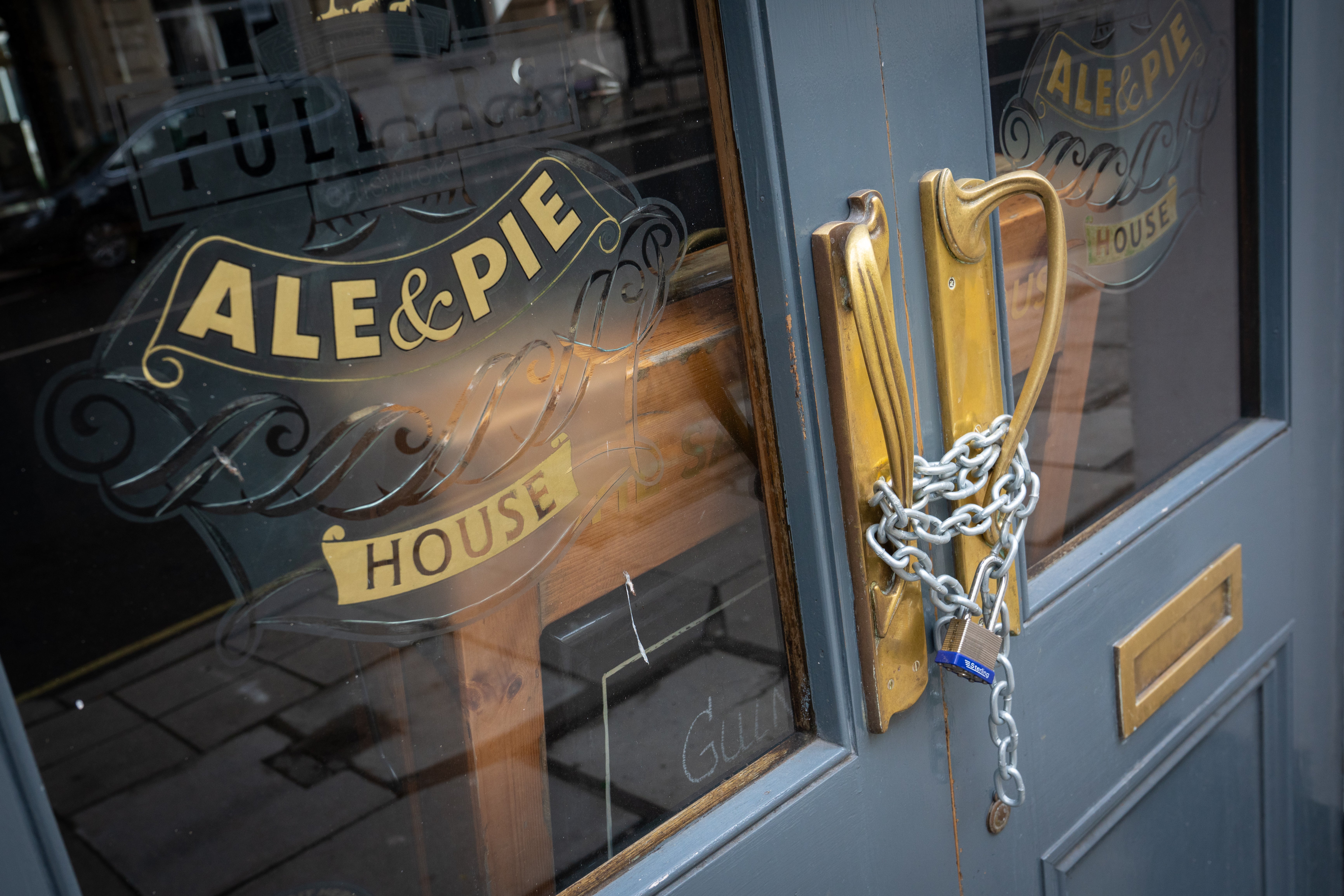 Doors of a closed pub in London. Pub, restaurants and other hospitality venues have warned that rocketing energy prices could lead to closures without support (Dominic Lipinski/PA)