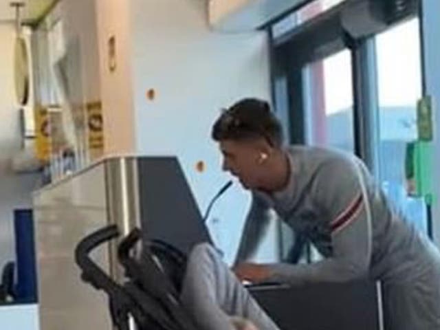 <p>The man making fake flight delay announcements at the airport in Zante</p>