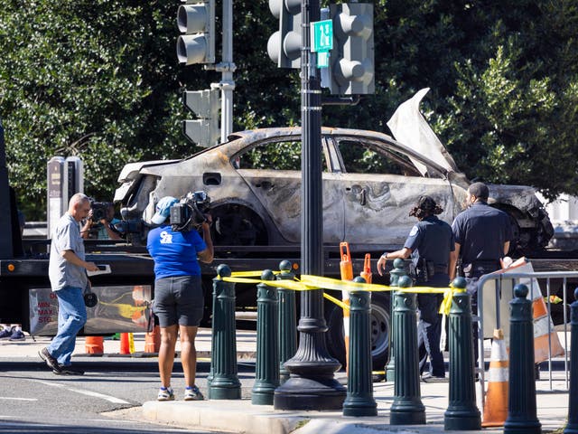 <p>A tow truck removes a car that crashed into a US Capitol barricade in Washington, DC, USA, 14 August 2022</p>