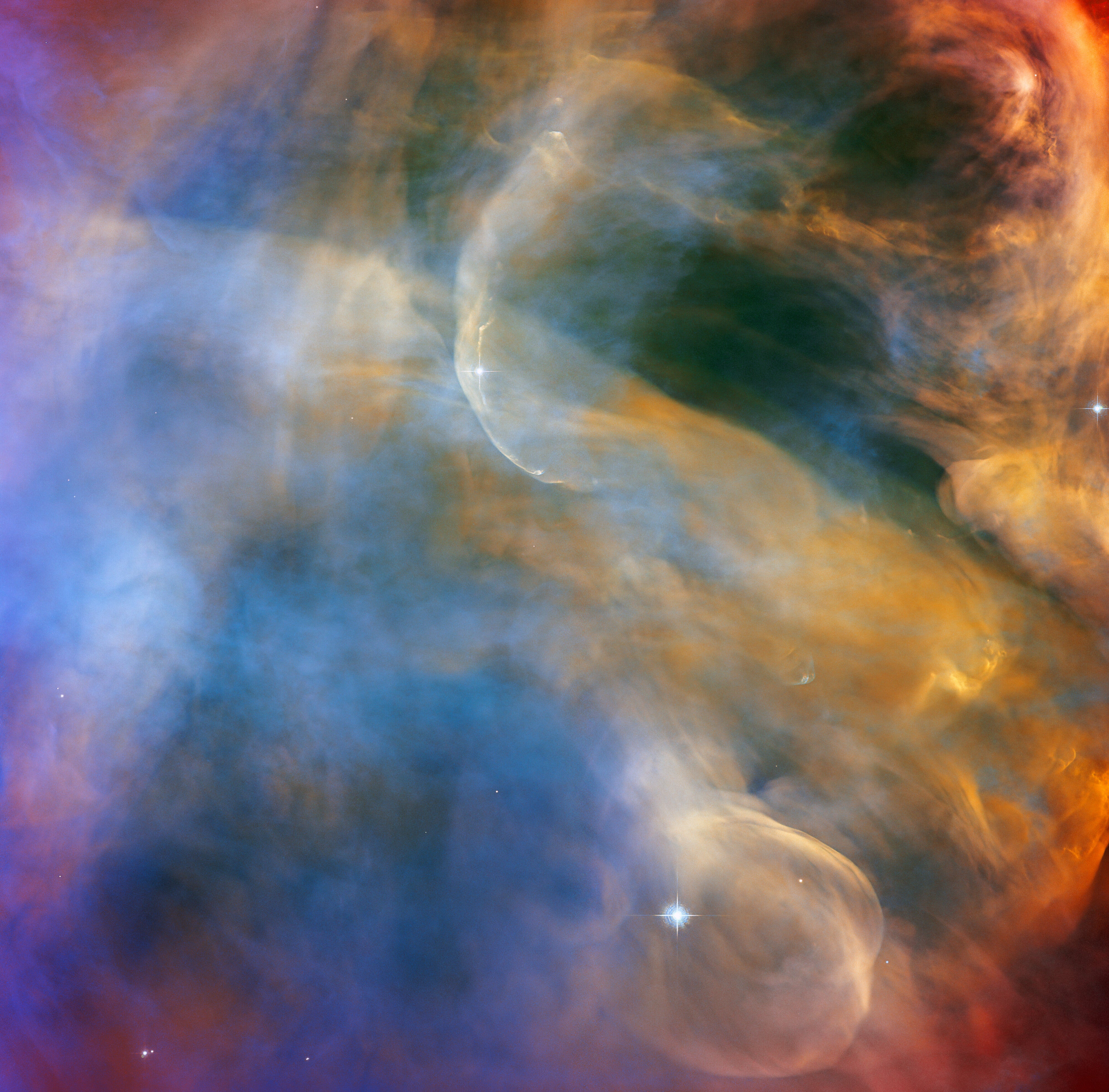 The Hubble Space Telescop reveals colorful outflows of stellar gas in the Orion Nebula