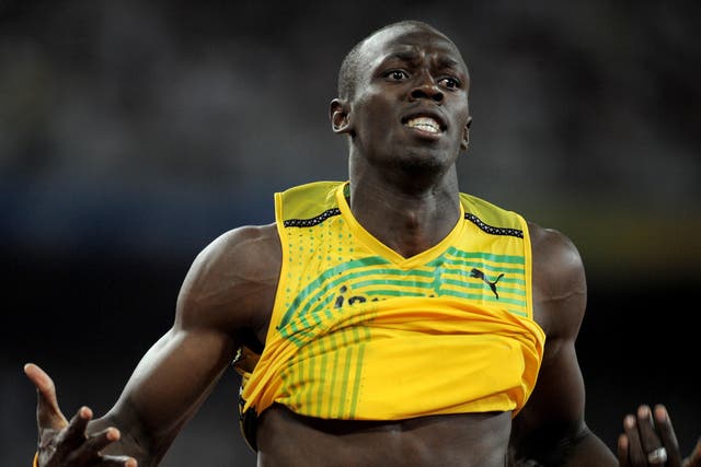 Usain Bolt celebrates his 100 metres victory in Beijing (Gareth Copley/PA)