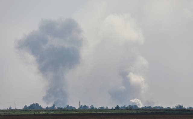 <p>Smoke rises above the Crimean village of Mayskoye after explosions on Tuesday </p>