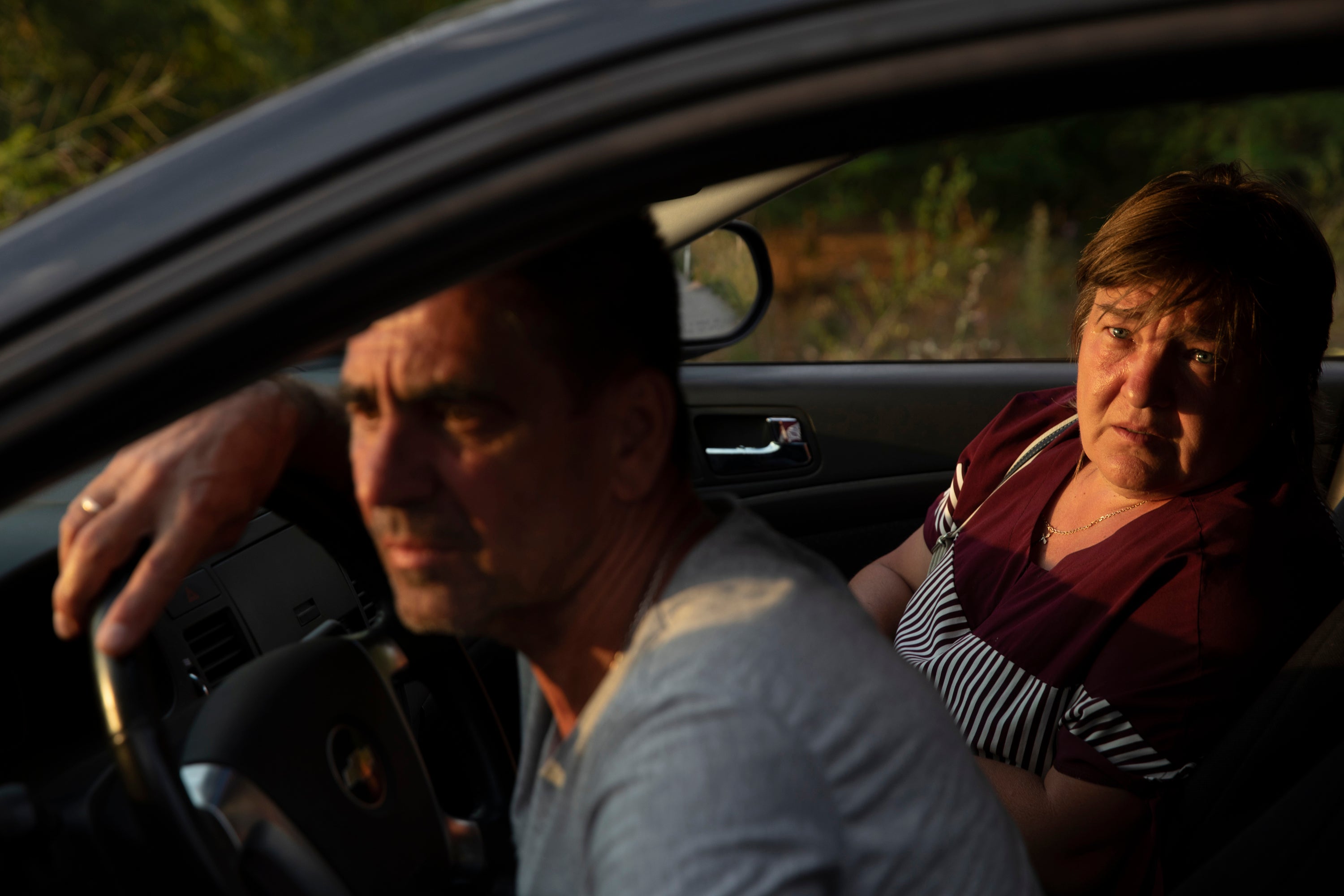 Svitlana, 53, who worked at the Zaporizhzhia nuclear power plant, with husband Oleksandr, 56, wait in a convoy arriving in Ukrainian-held territory
