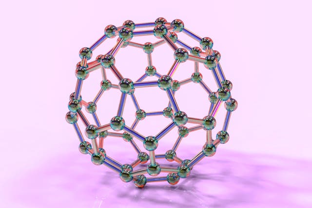 <p>A model of a Fullerene molecule, or “Bucky Ball,” a complex, soccer-ball like assemblage of 60 carbon atoms</p>