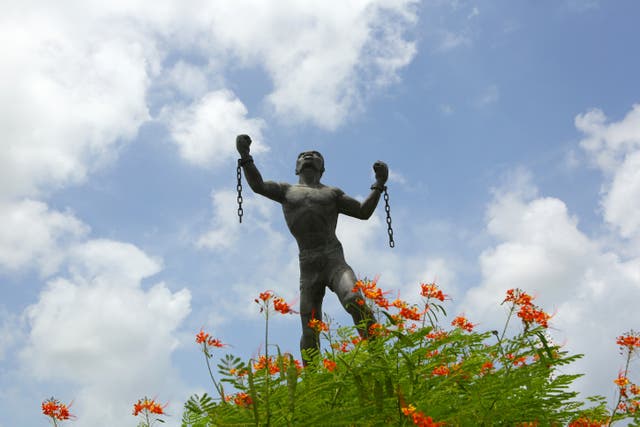 <p>The Emancipation Statue, known by locals as Bussa, located at St Barnabas roundabout outside of Bridgetown in Barbados (Johnny Green/PA)</p>