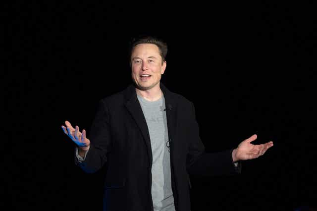 <p>In this file photo taken on 10 February 2022, Elon Musk gestures as he speaks during a press conference at SpaceX's Starbase facility </p>
