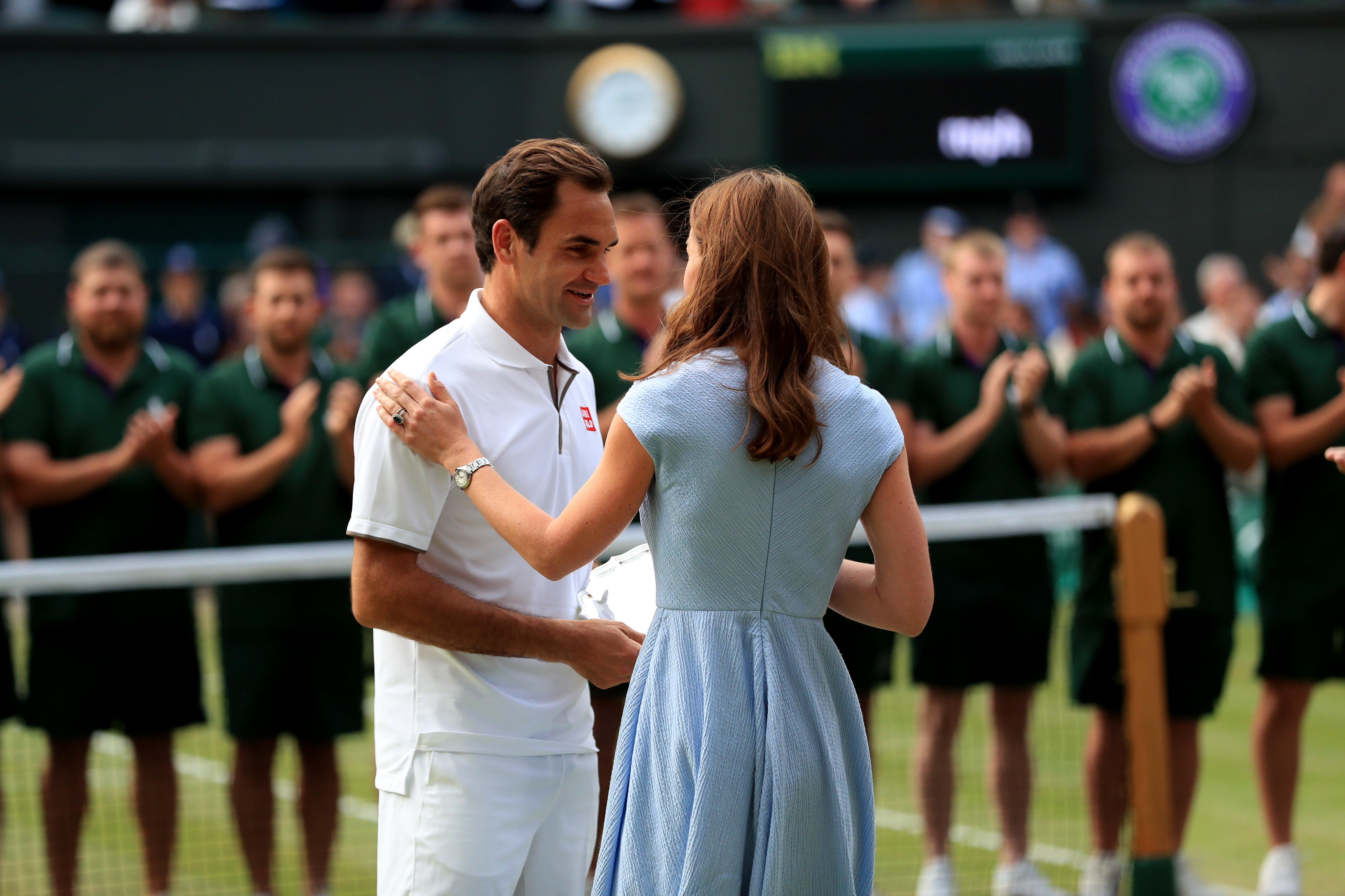 Roger Federer is presented with the runners-up trophy by the Kate at Wimbledon in 2019 (Mike Egerton/PA)