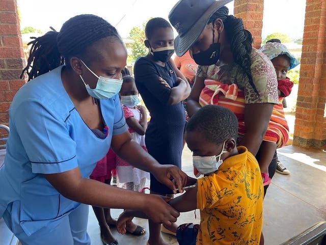 <p>A child receives a measles vaccine in Zimbabwe  </p>