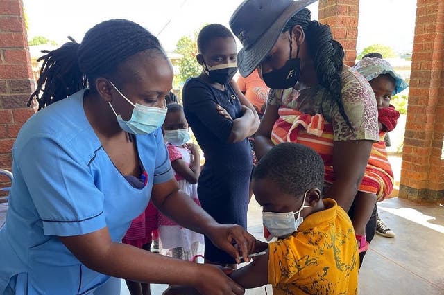 <p>A child receives a measles vaccine in Zimbabwe  </p>