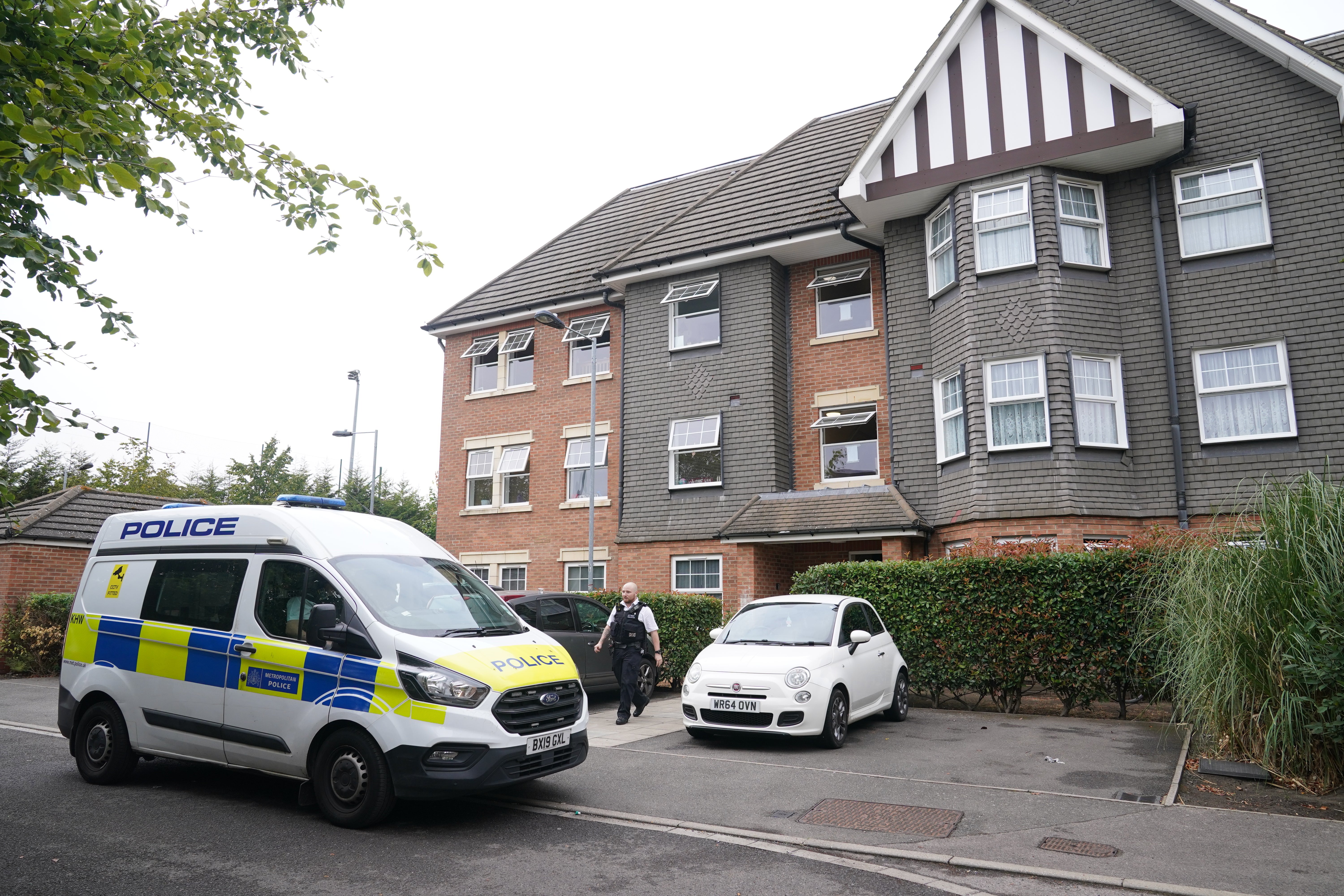 Police at the scene in Ealing after Aziza Bennis was stabbed to death