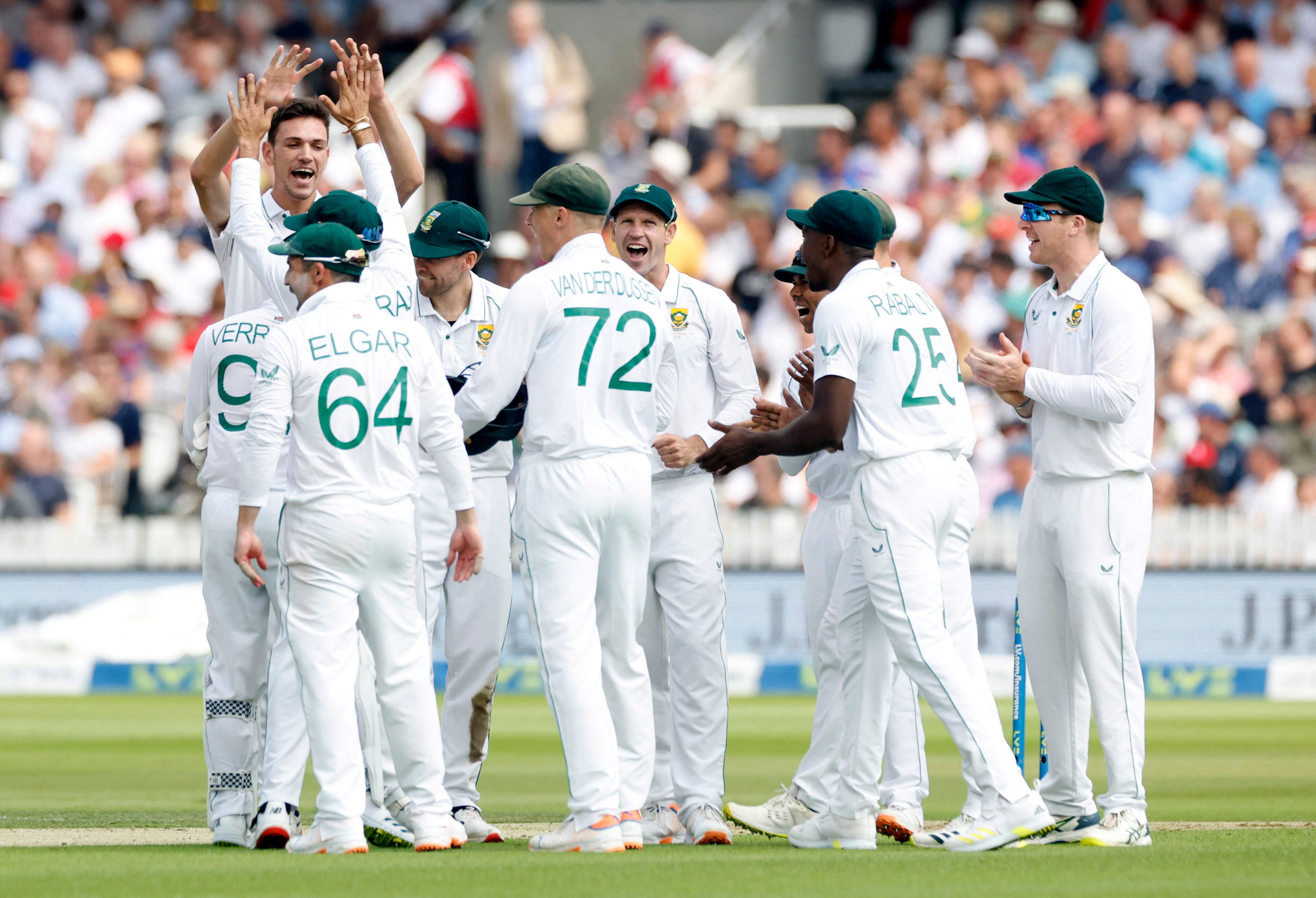 Marco Jansen is congratulated by his teammates after getting Joe Root out