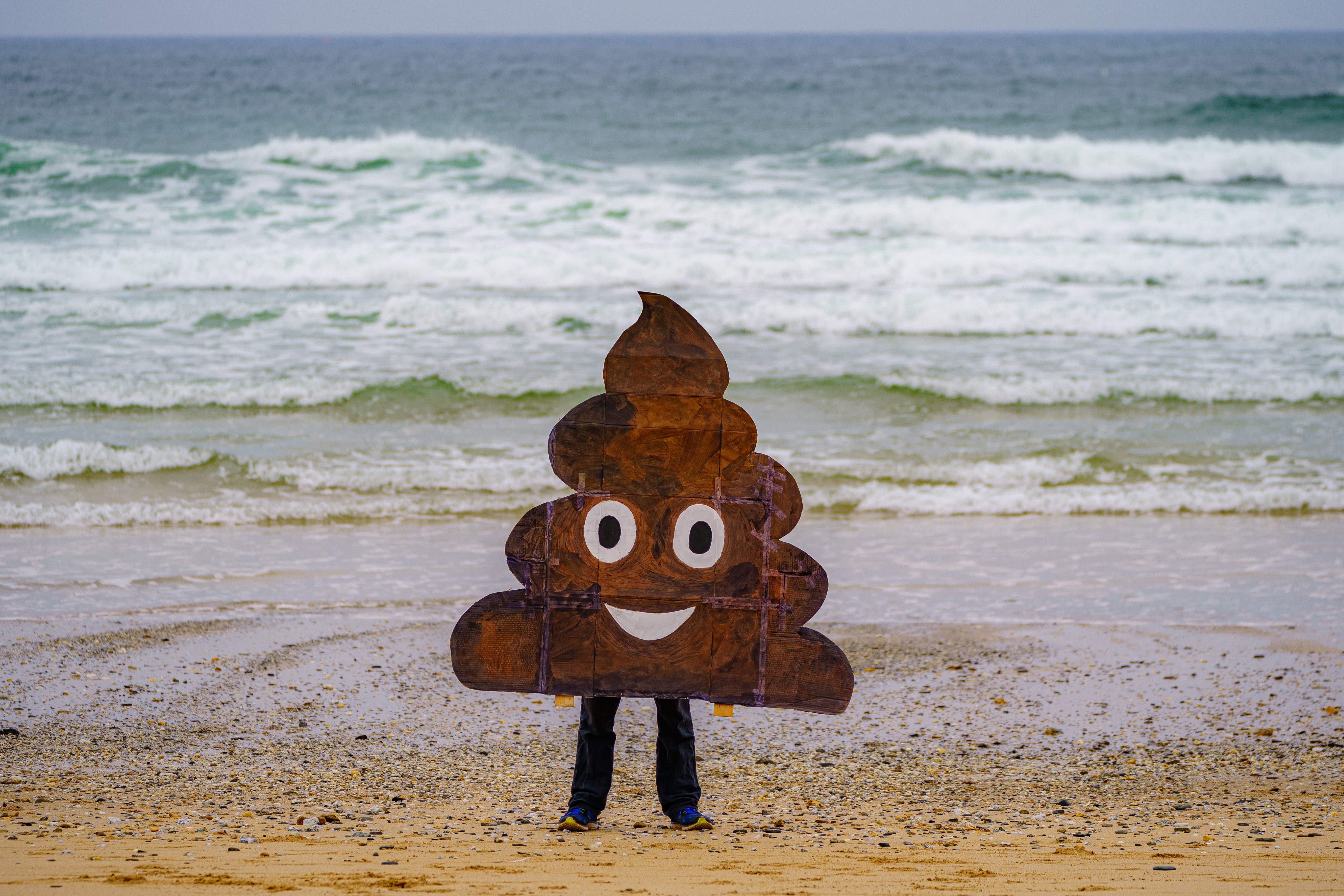 Anti-sewage campaigners on Fistral Beach in north Cornwall (Ben Birchall/PA)