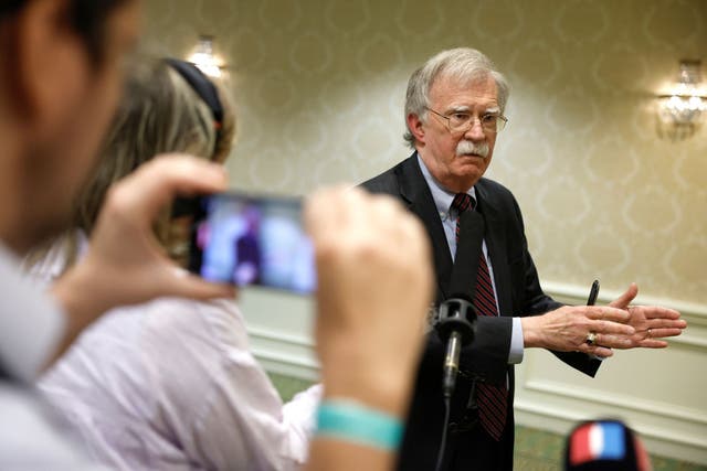 <p>John Bolton holds a gaggle with reporters in Washington DC</p>