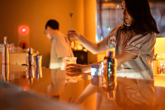 <p>A bartender making a cocktail at a non-alcoholic bar in Tokyo</p>