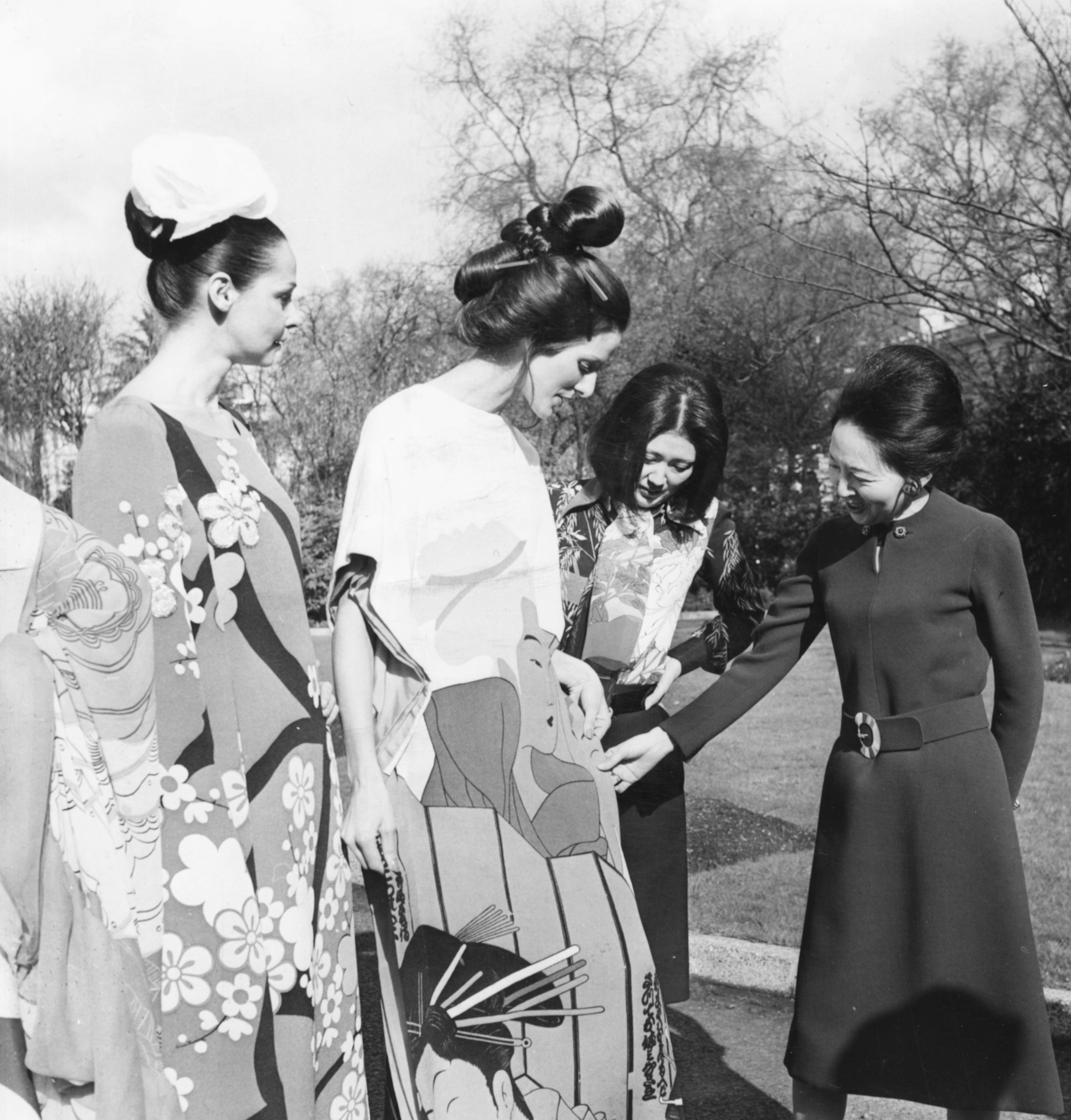Madame Yukawa (right), wife of the Japanese Ambassador, talking to designer Hanae Mori (second right) in London in 1972