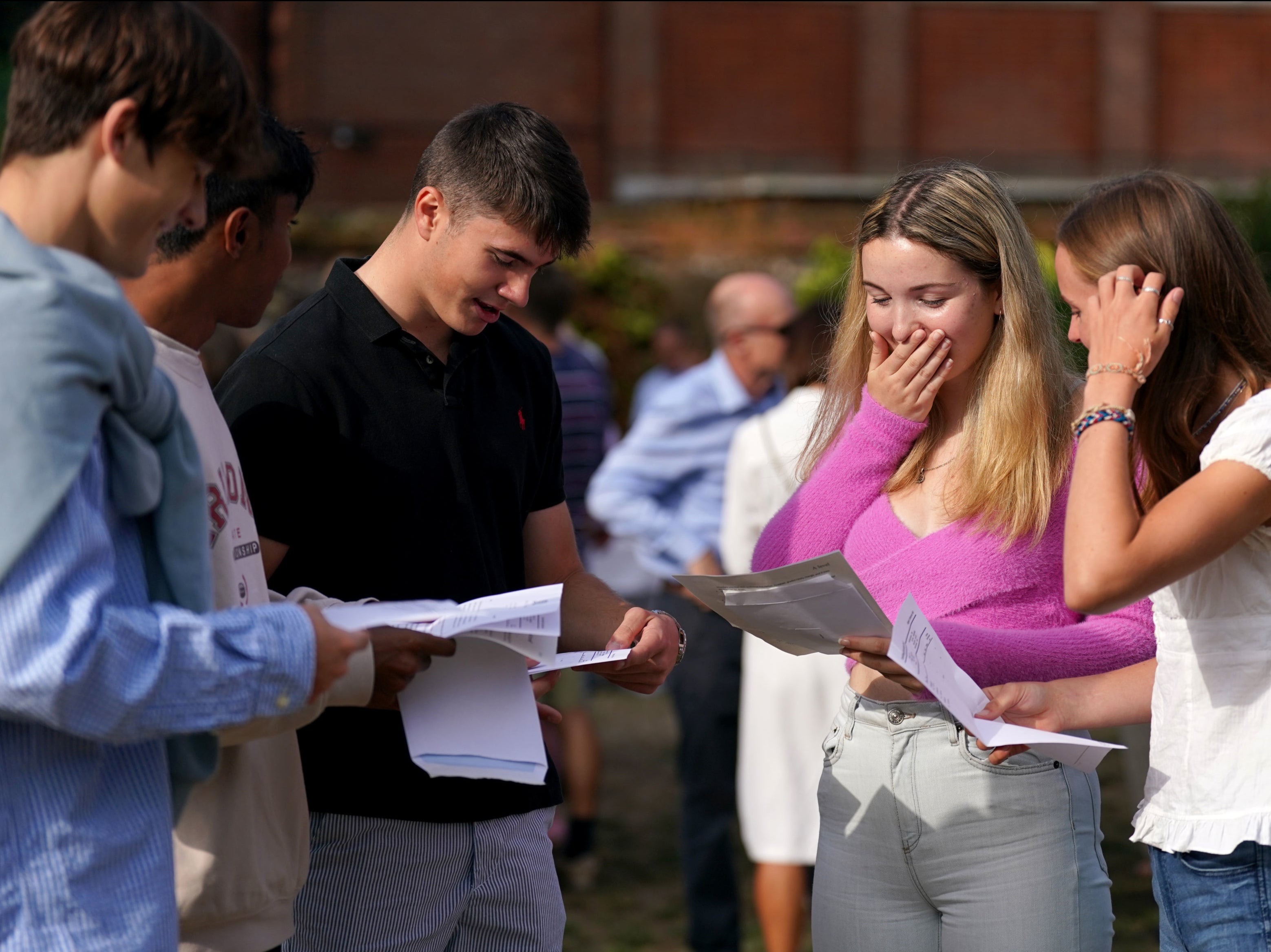 Anna Austin (centre-right) reacts when reading their A-level results at Norwich School