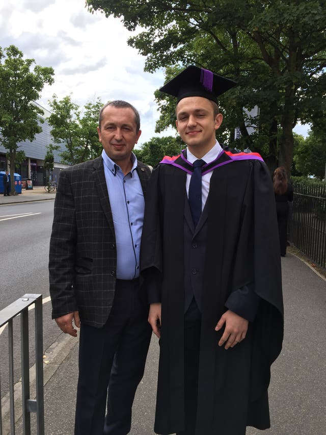 Sasha Rudyy, left, and his son at his graduation (family handout/PA)
