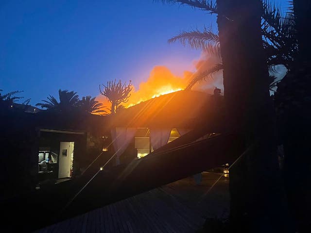 <p>A wildfire burns behind fashion designer Giorgio Armani’s villa on Pantelleria, an island off the coast of Sicily</p>