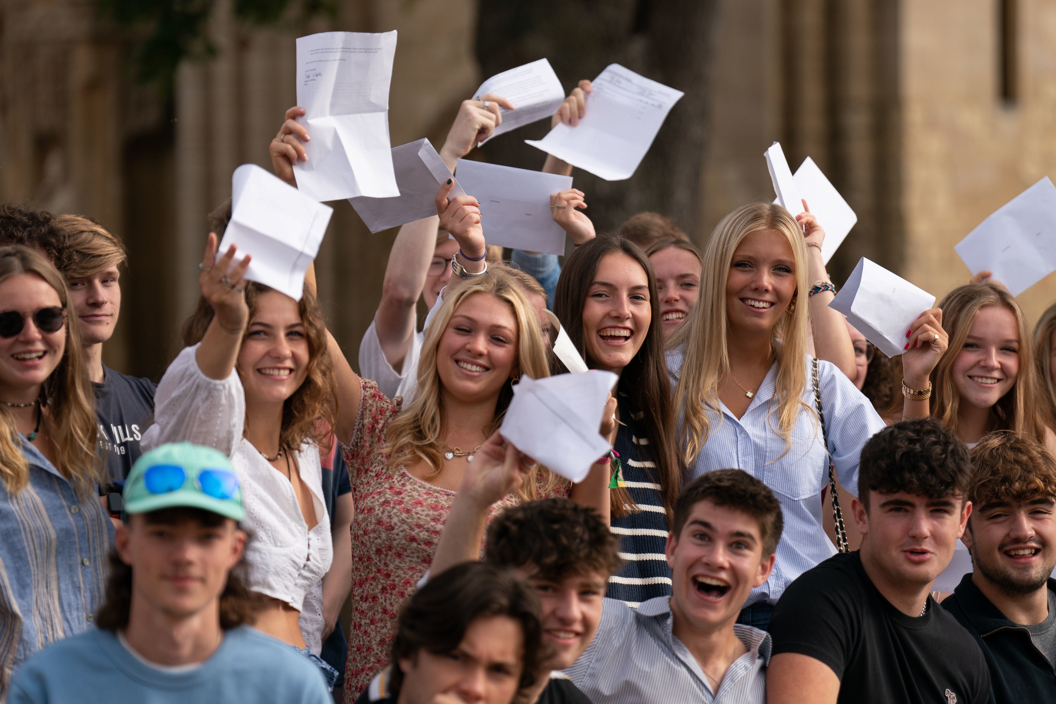 <p>Pupils celebrate with their A-level results at Norwich School, Norwich</p>