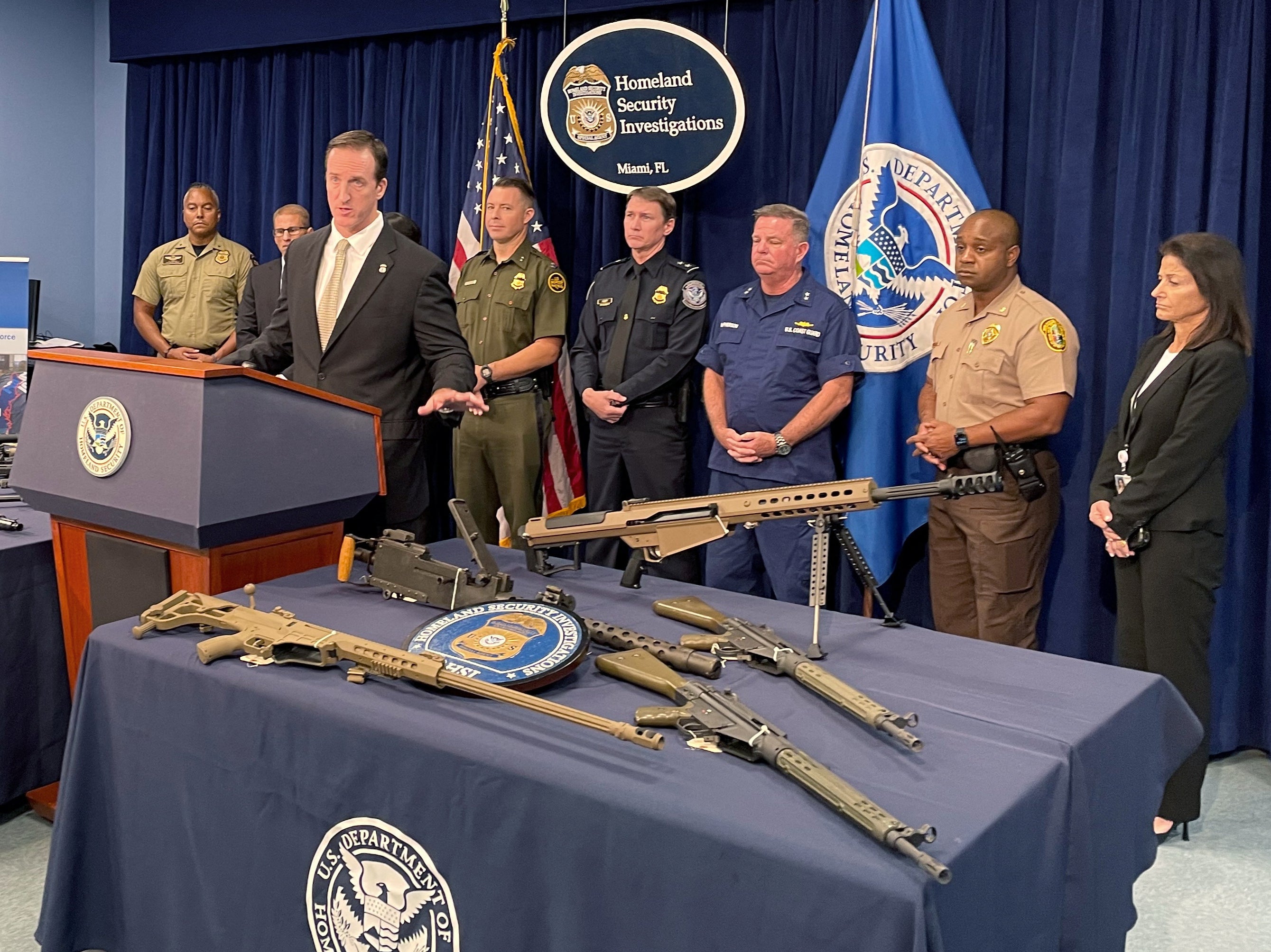 Anthony Salisbury, Special Agent in Charge of Homeland Security Investigations Miami speaks as weapons seized by U.S. authorities that had been destined for illegal export to Haiti are displayed at a news conference in Miami, Florida