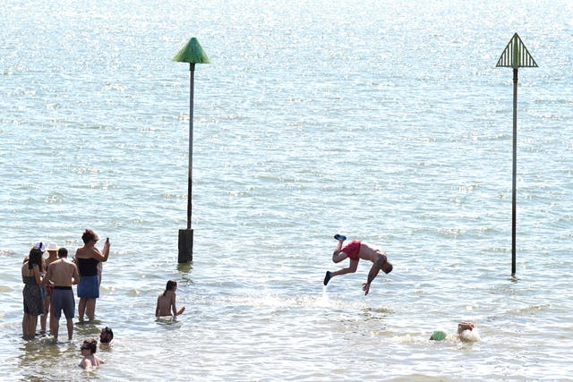 People gathered in the hot weather at Southend-on-Sea beach during the summer heatwave (Stefan Rousseau/PA)