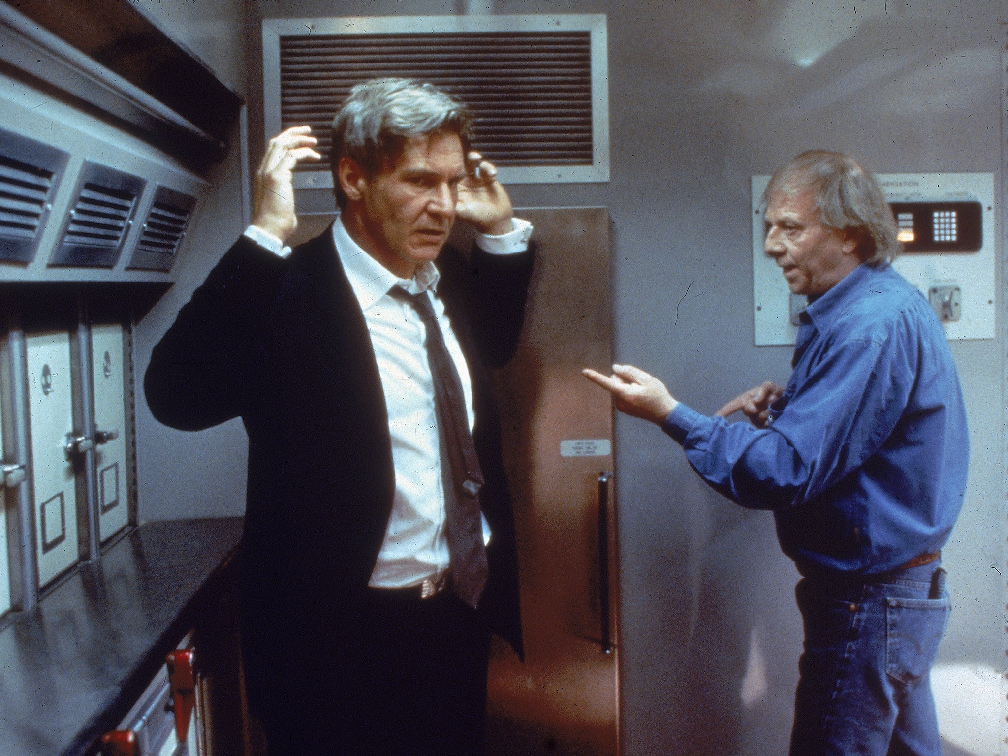 Petersen (right) instructs American actor Harrison Ford on the set of Peterson’s film ‘Air Force One’