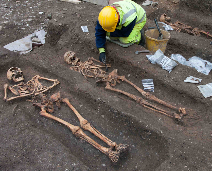 Archaeologists from the Cambridge Archaeological Unit excavate the remains of friars buried at the city’s former Augustinian friary