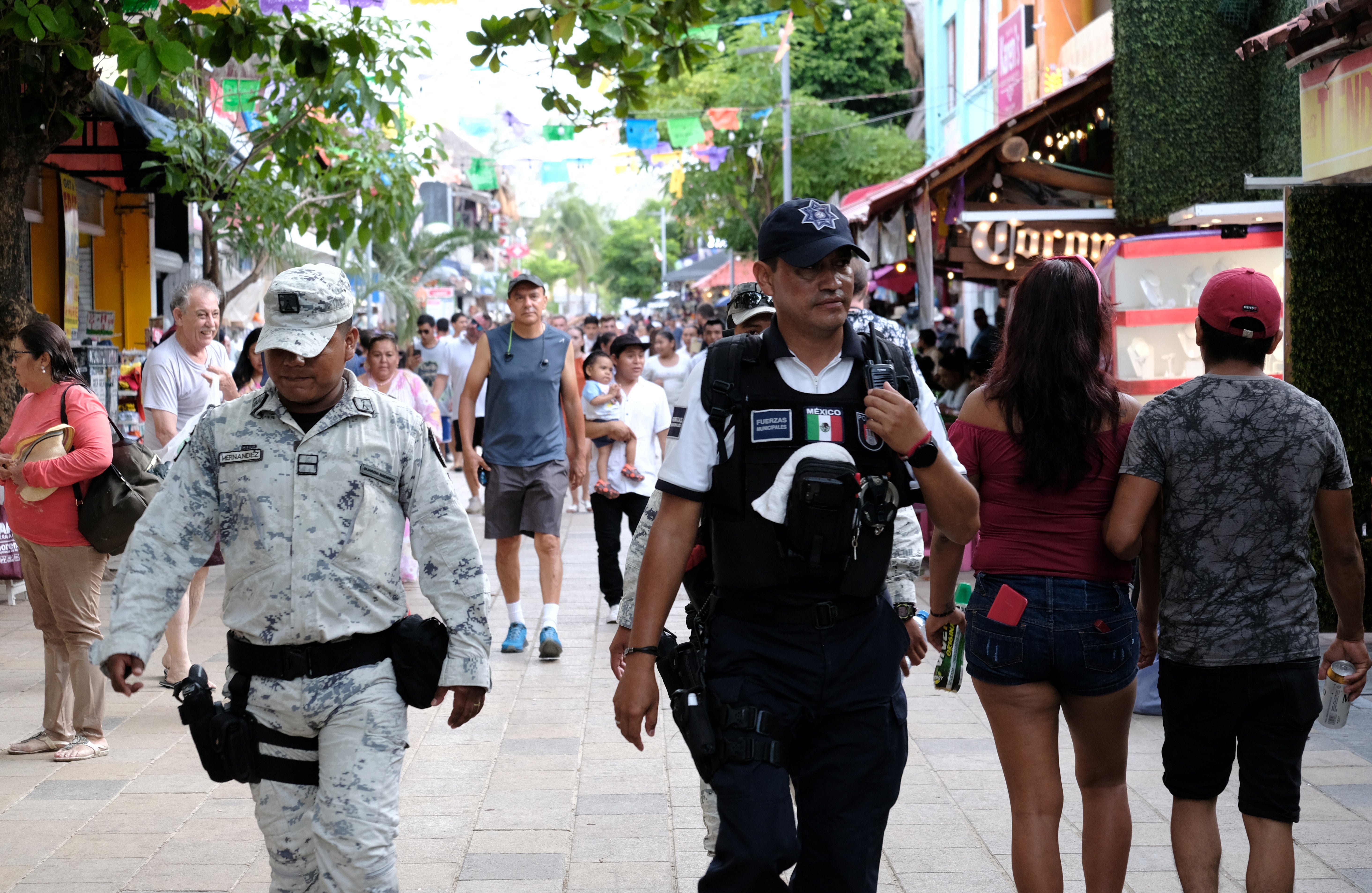 Members of the security forces patrol in Playa del Carmen on 24 July 2022