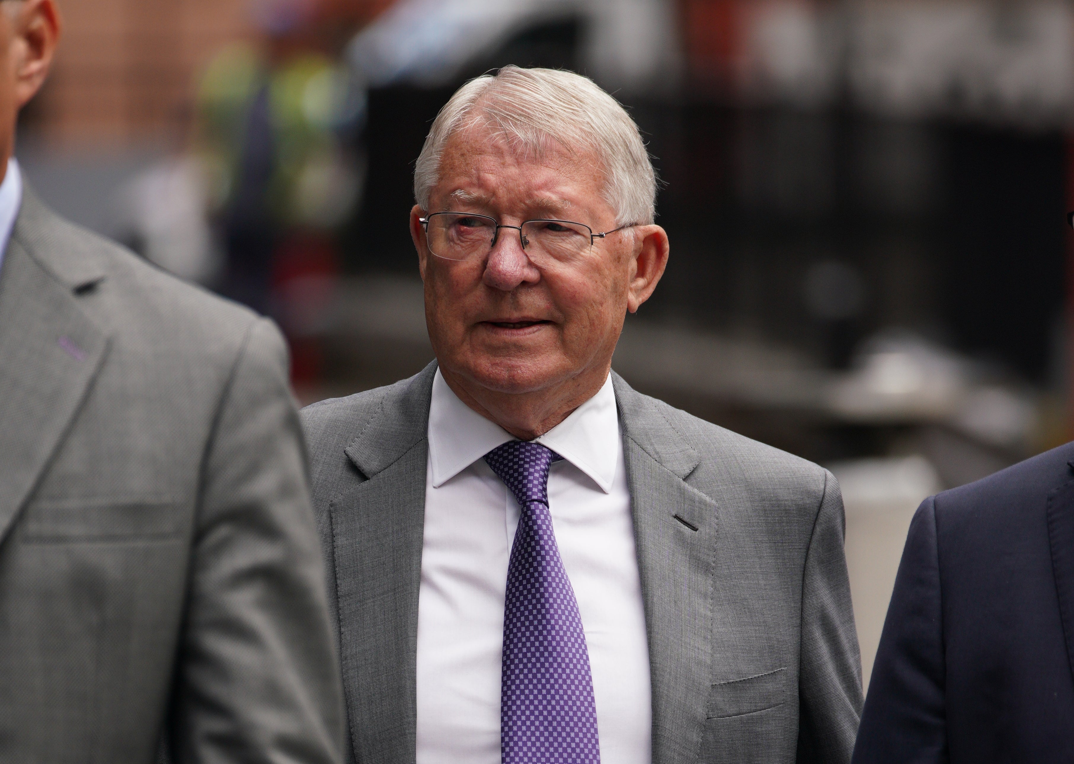 Sir Alex Ferguson arriving at Manchester Crown Court to give evidence in the trial of Ryan Giggs (PA)