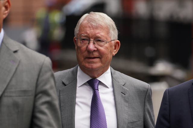 Sir Alex Ferguson arriving at Manchester Crown Court to give evidence in the trial of Ryan Giggs (PA)