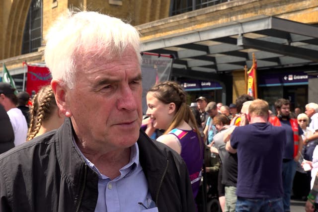 John McDonnell at a rally outside London’s King’s Cross Station during a rail strike in June (Rebecca Speare-Cole/PA)