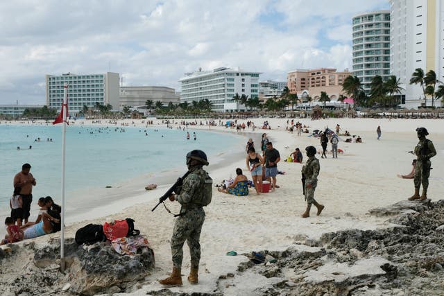 <p>Members of the Navy patrol a beach resort as part of the vacation security in the tourist zone in Cancun by the government of Quintana Roo</p>