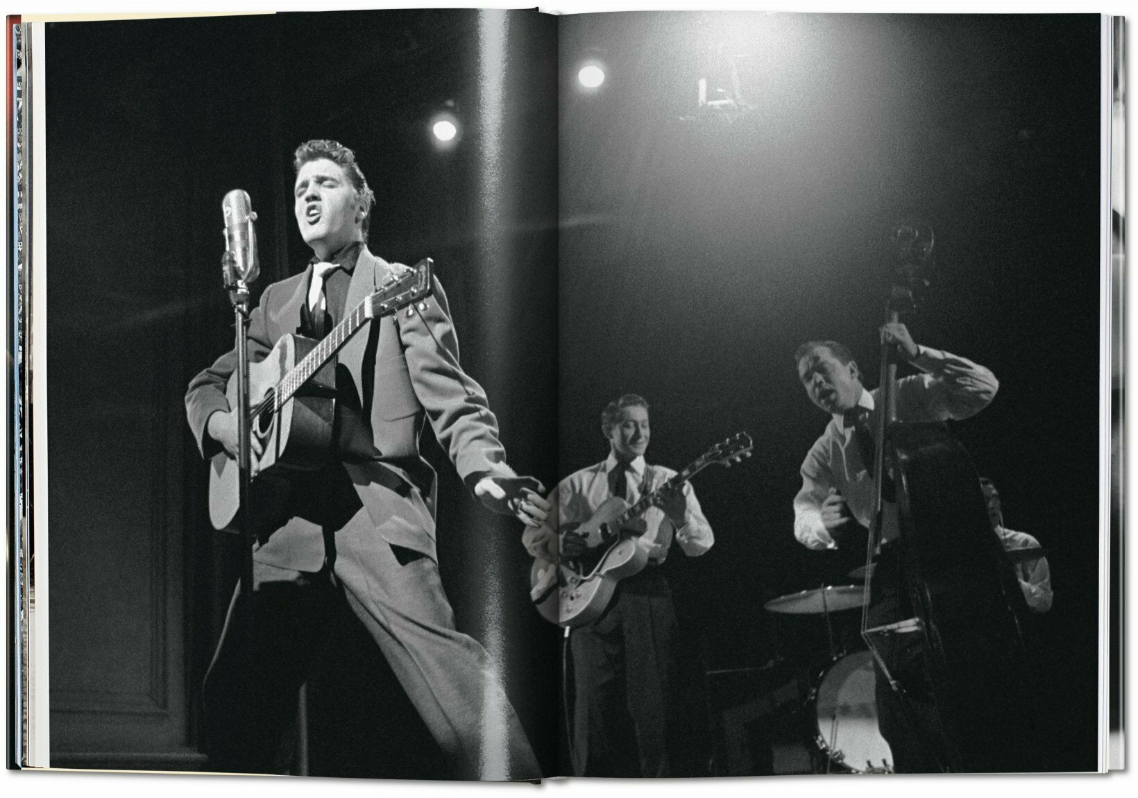 Elvis with Scotty Moore on guitar, Bill Black on bass and DJ Fontana on drums during a live performance on Stage Show, 17 March 1956