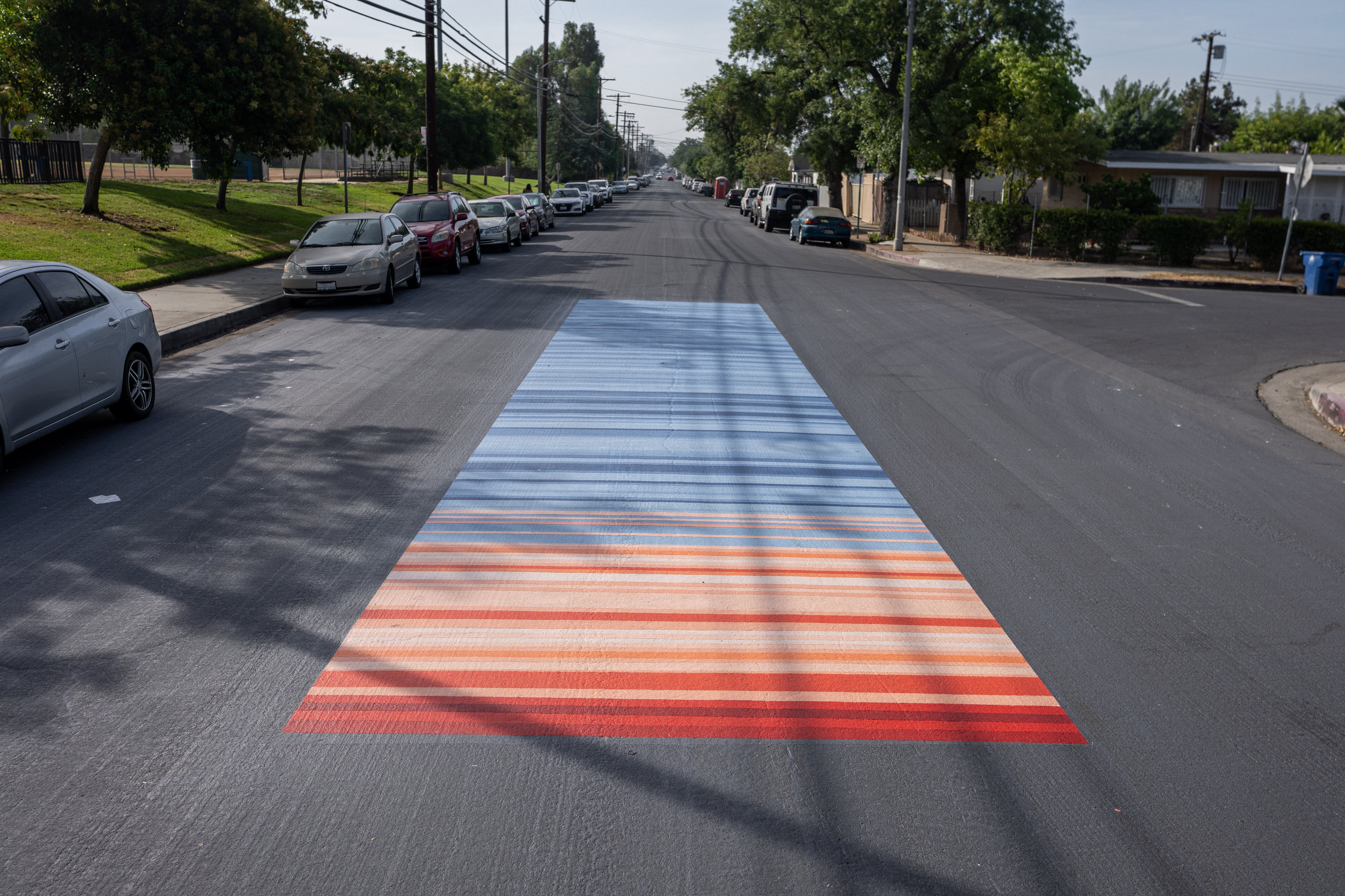 Reflective paint showing “warming stripes”, a depiction of how much the temperature has changed in the area over the years