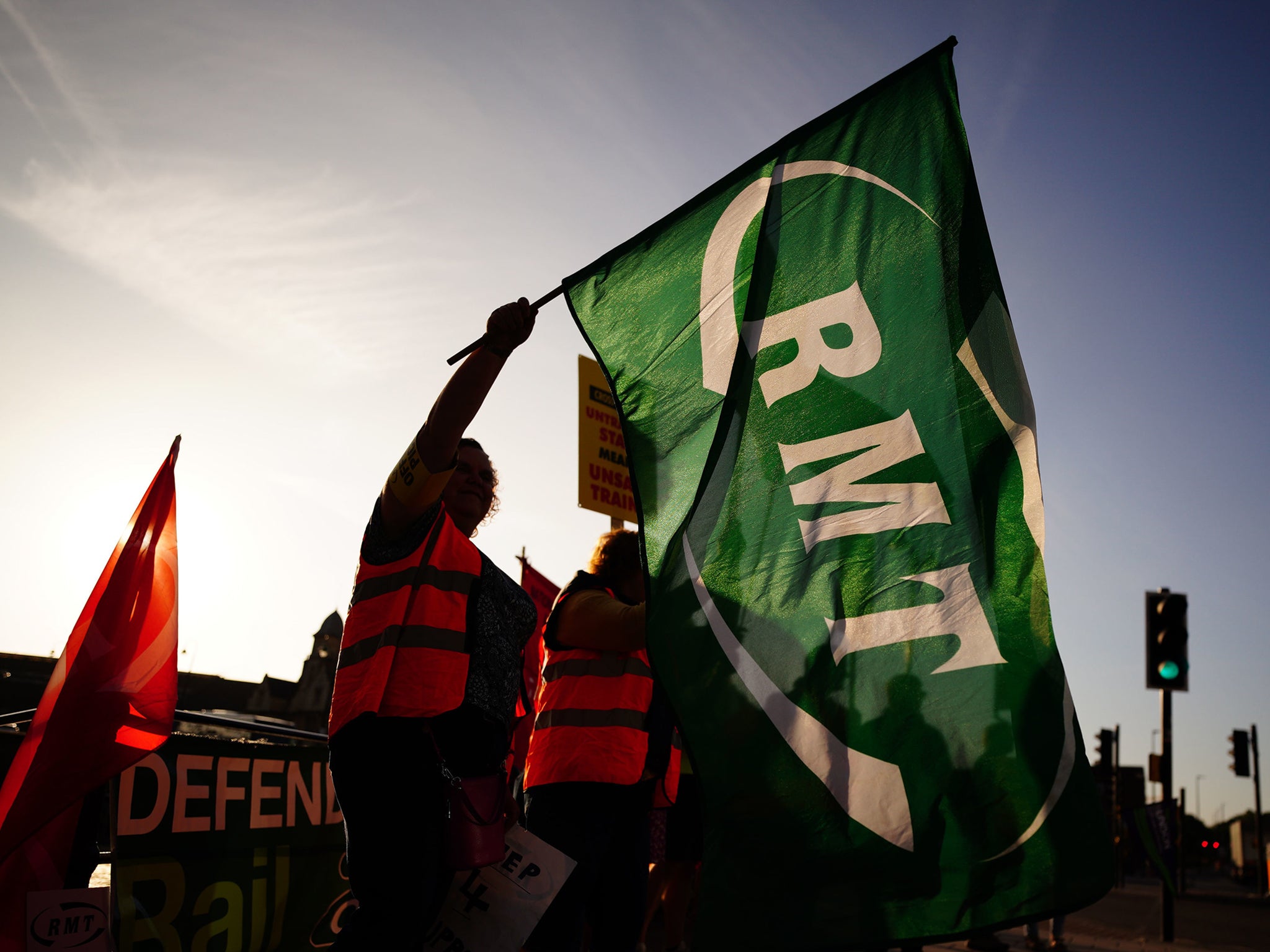 Members of the Rail, Maritime and Transport union (RMT) on the picket line outside Bristol Temple Meads station as union members take part in a strike over pay and conditions