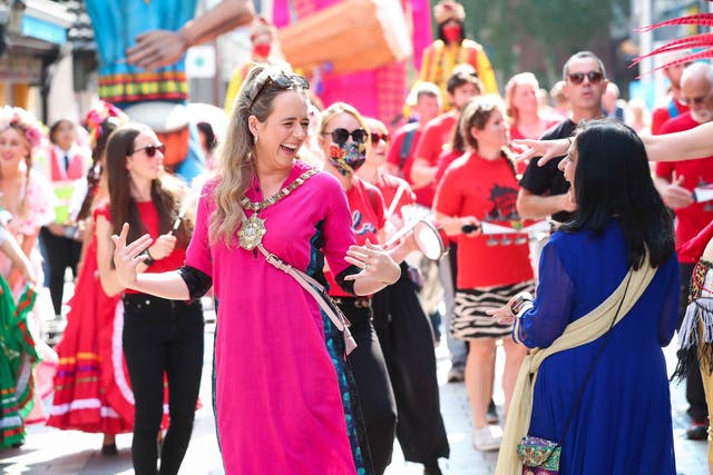 Lord Mayor Kate Nicholl and Nisha Tandon taking part in the Mela annual procession (Kelvin Boyes/Press Eye)