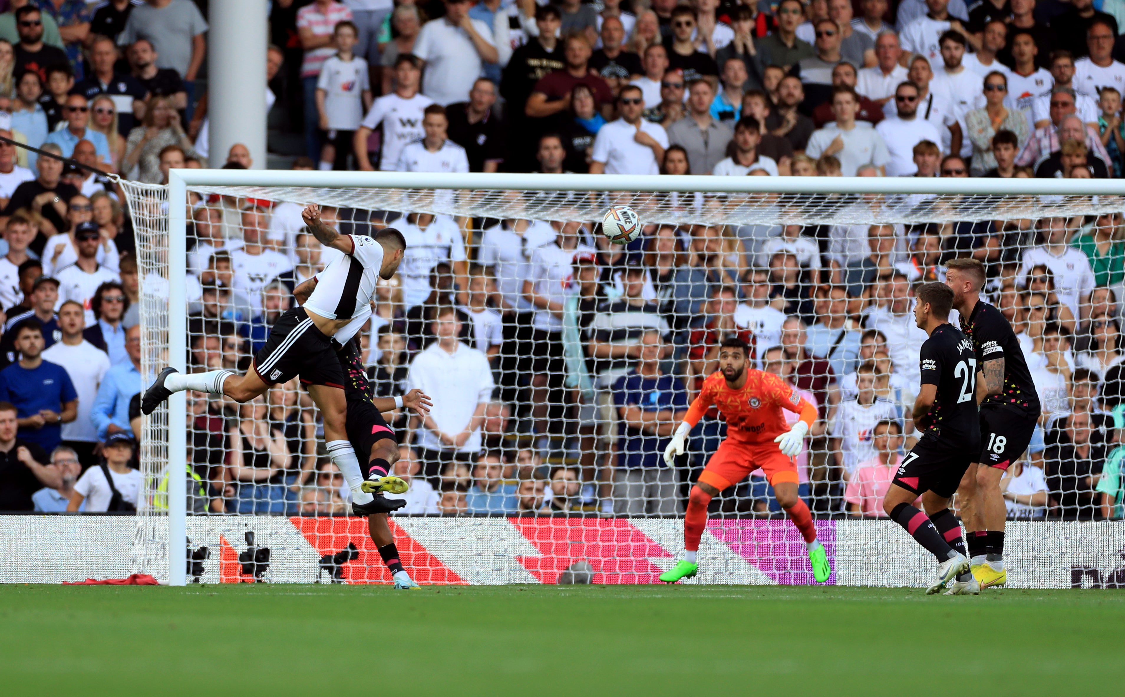 Mitrovic guides his header past Brentford goalkeeper David Raya to claim all three points for Fulham