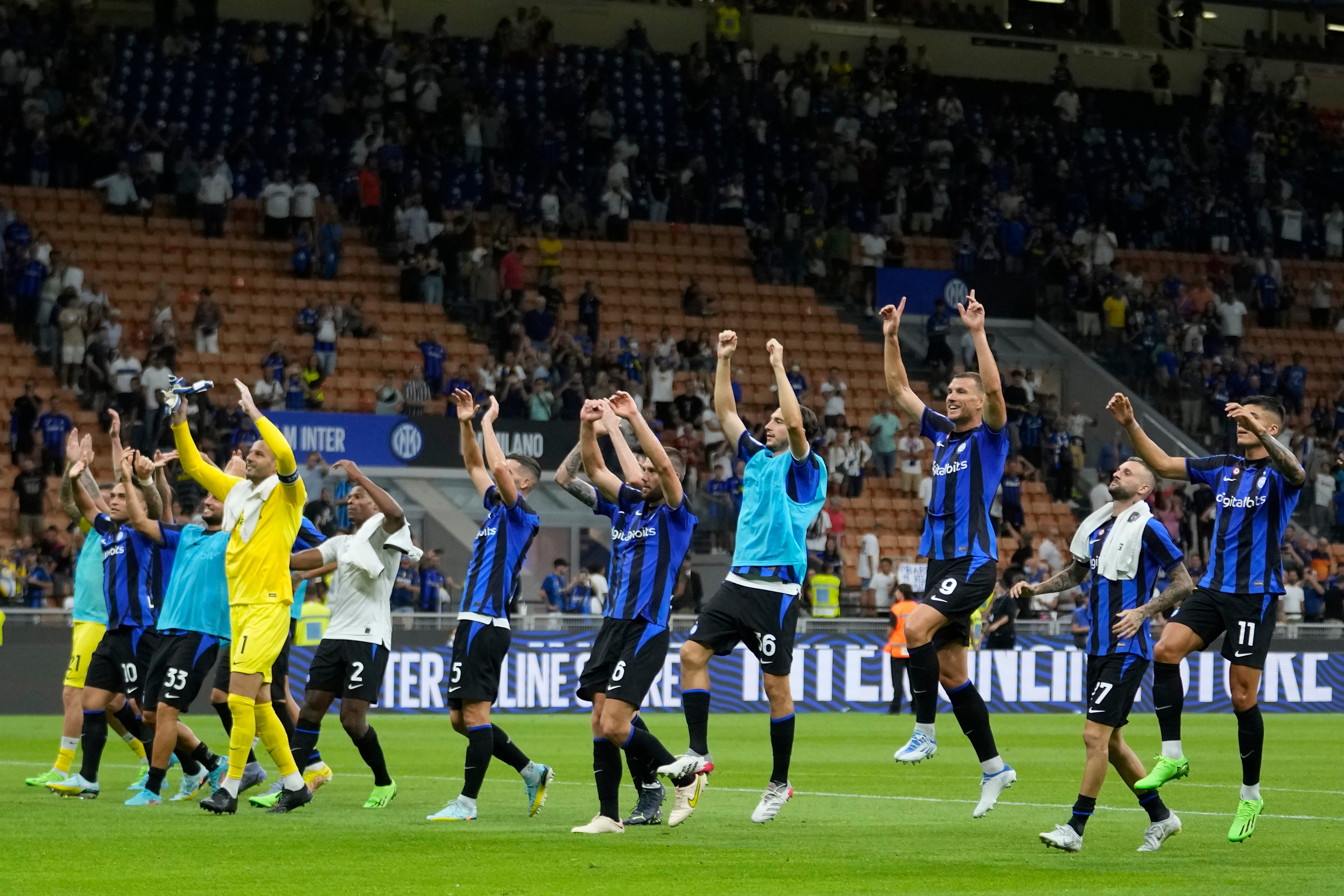 Inter players celebrate their win against Spezia (Luca Bruno/AP)
