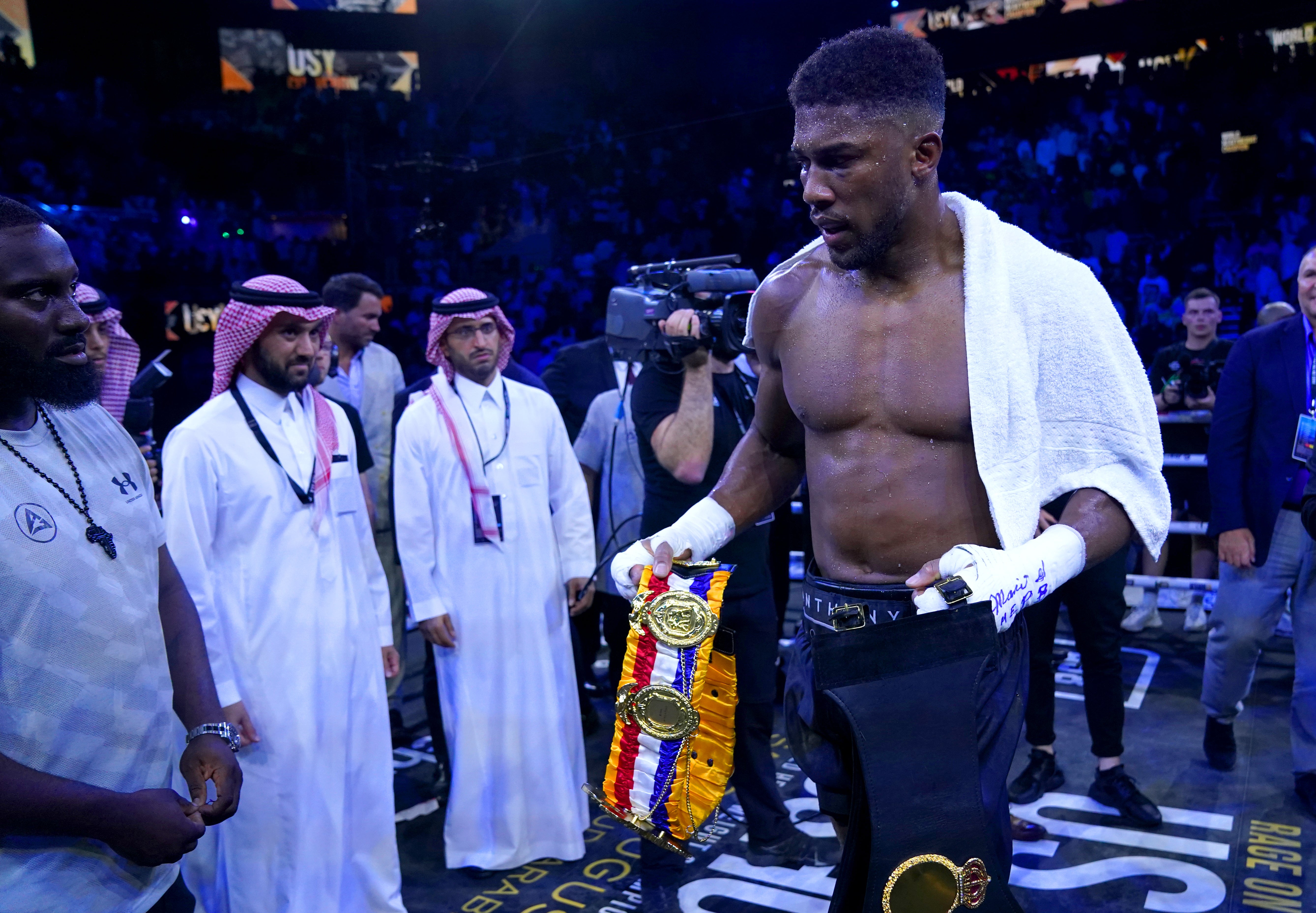 Anthony Joshua briefly walked off with the belts