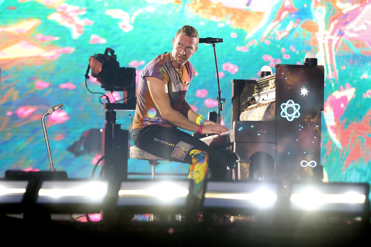 Chris Martin pauses Coldplay concert to design tattoo for mega fan in crowd